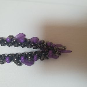 2 necklaces!! 1 purple/almost mercury silver. 1 Black beads w/ large beads